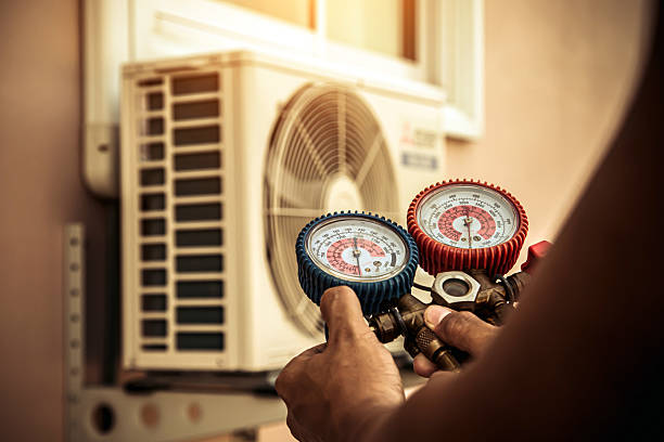 Professional Air Conditioning Service technician working in Tobaccoville, NC